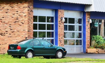 auto-repair-nightmare-cheap-repair-shop old car parked in front of cheap repair shop