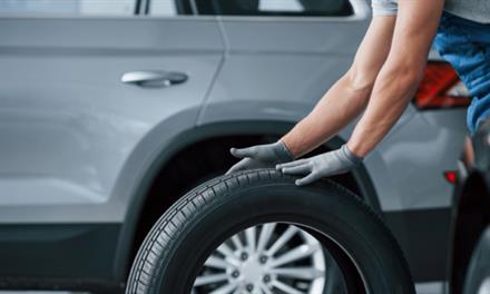 neglecting-tire-maintenance mechanic changing a tire